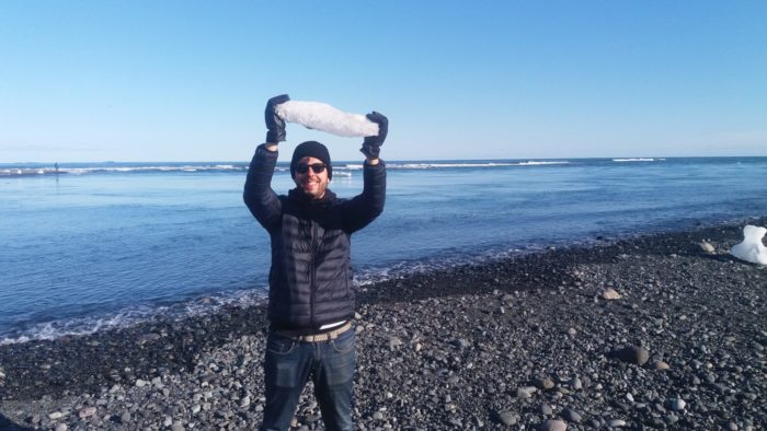 Michael playing with ice at the Diamond Beach, Iceland