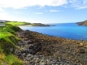 The beautiful turquoise sea in Scourie on the NC500