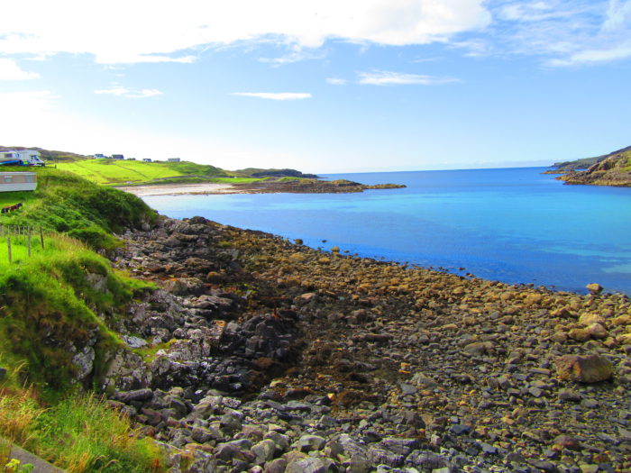 The beautiful turquoise sea in Scourie on the NC500