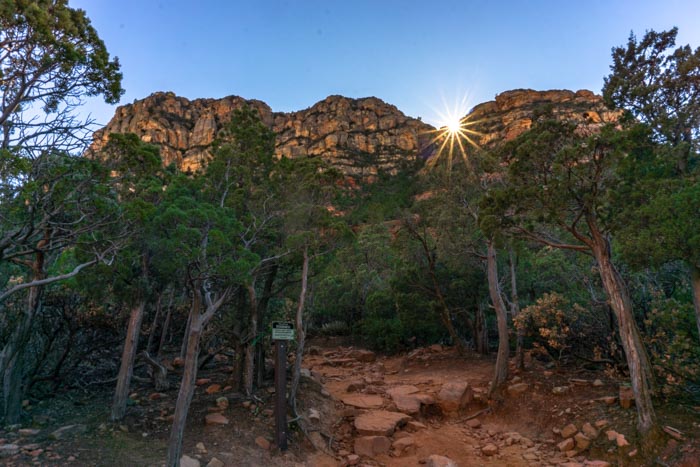 Sun behind Sedona's red rocks in Arizona