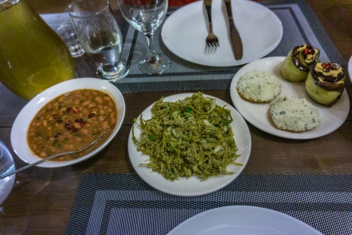 Assorted Georgian food including jonjoli, lobio and eggplant with walnuts