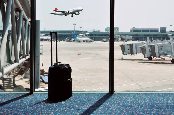 Waiting for your flight with your carry on luggage