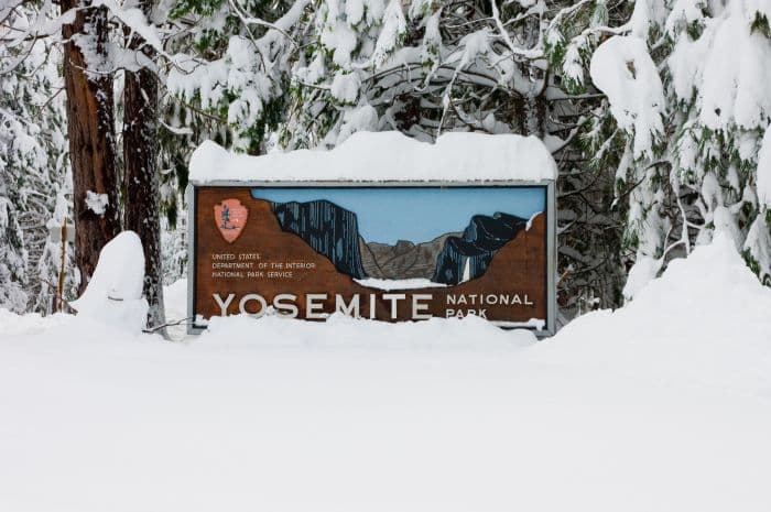 Yosemite sign covered in snow