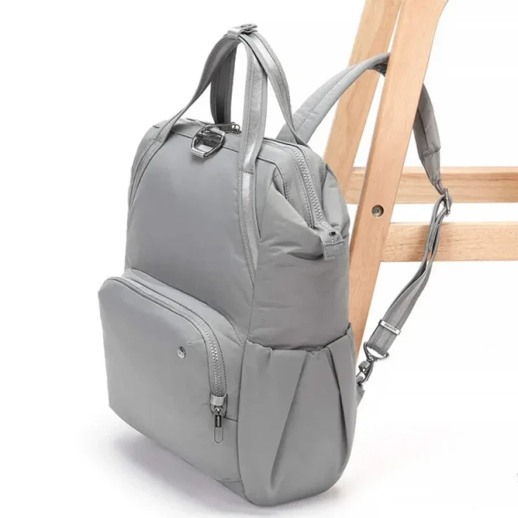 Pacsafe Citysafe CX 17L Anti-Theft Backpack - Gravity Gray - Side Attached to Table